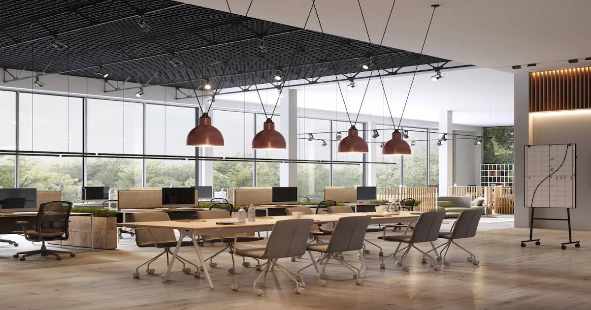 A contemporary office space with ergonomic chairs, modular desks, and biophilic design elements, creating a functional and stylish workplace.